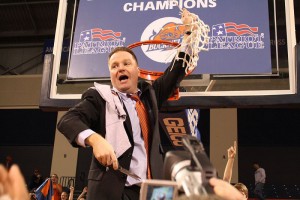 Dave Paulsen cuts down the net after he led his team to a Patriot League Championship in his third year of coaching the Bison