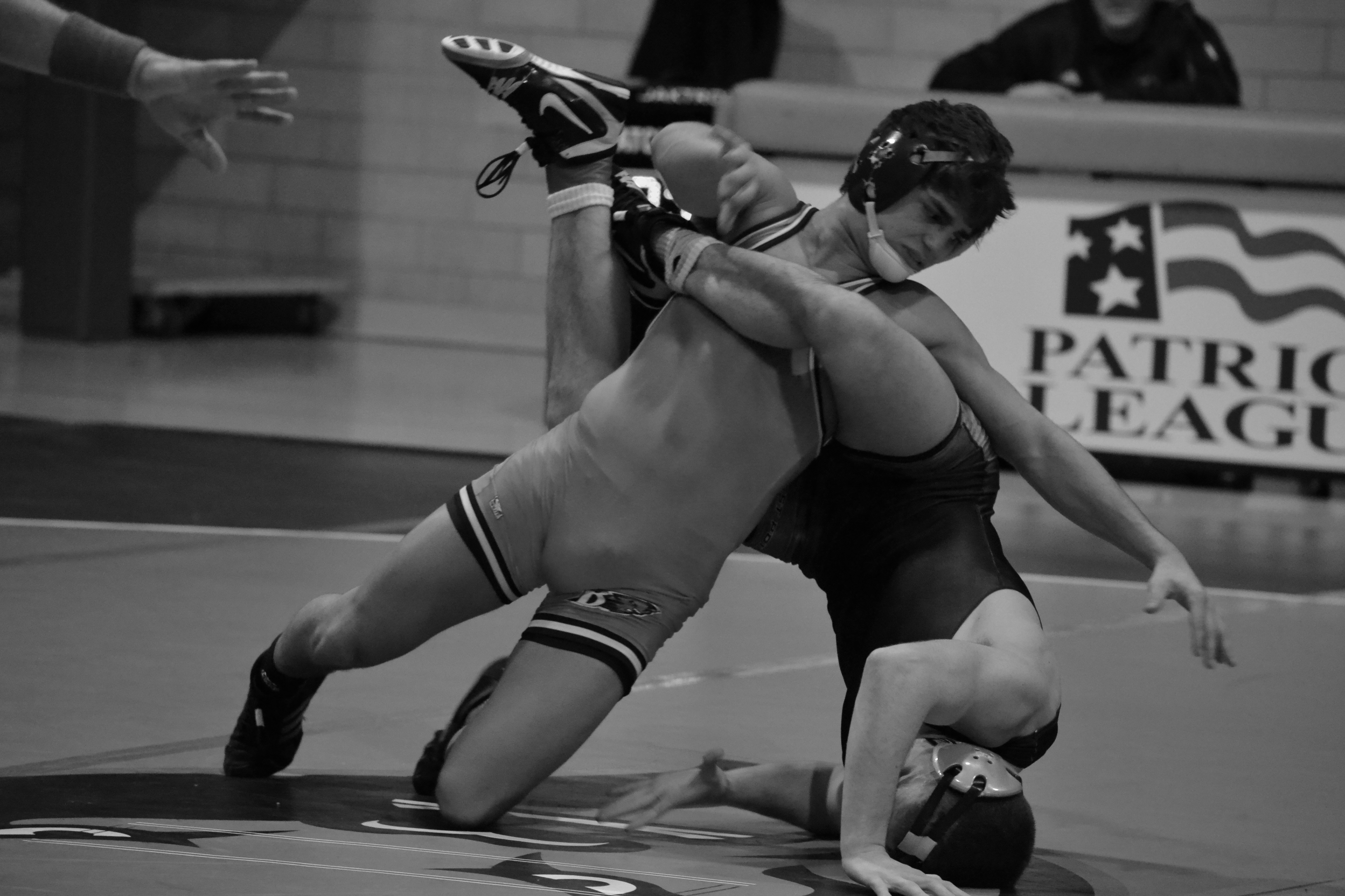 Estie Pyper | The BucknellianPaul Petrov '16 slams his opponent into the mat last Saturday. The Bison split the weekend, beating Columbia but falling to Army.