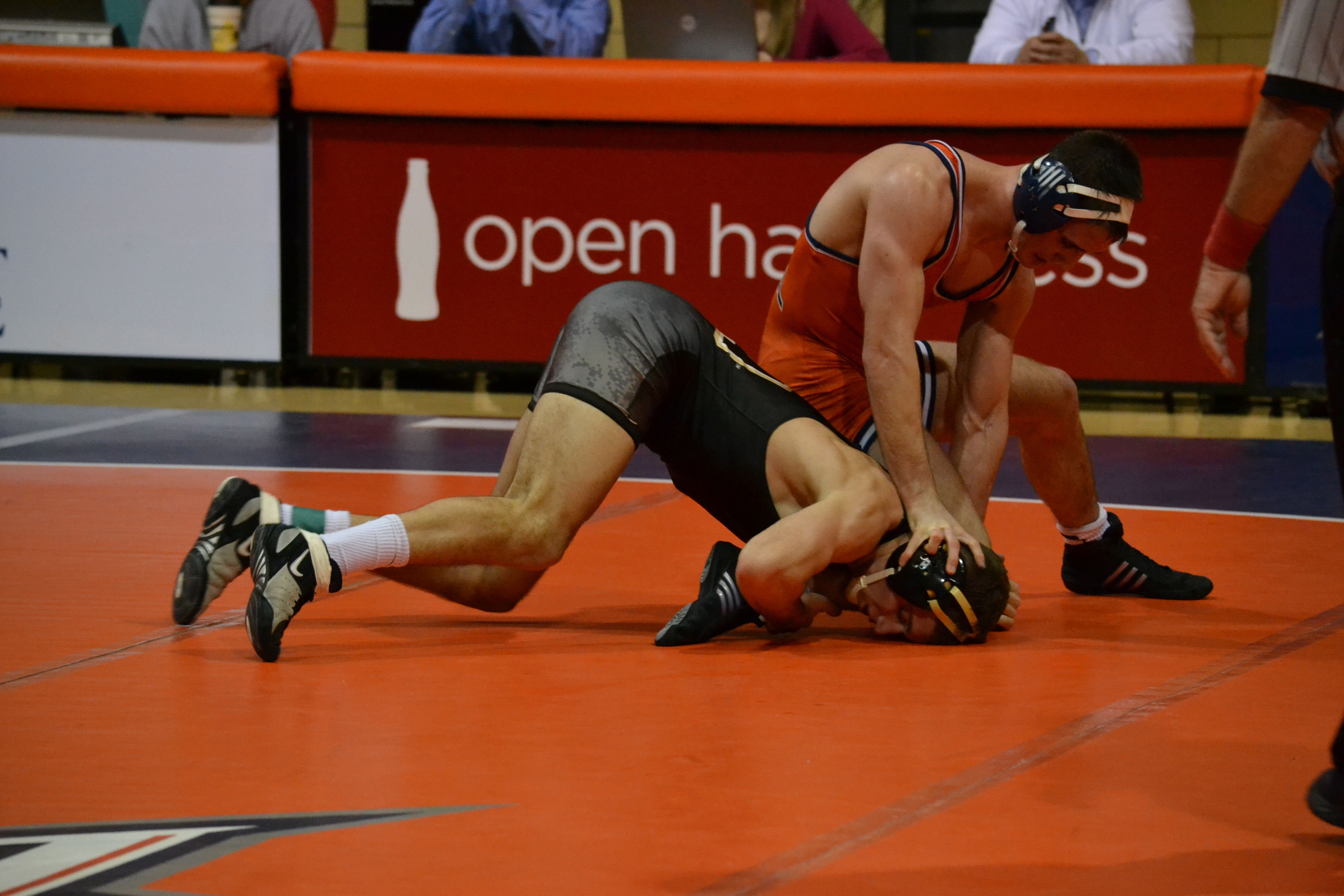 Estie Pyper | The BucknellianAdam Healey '13 slams an opponent into the mat. Despite a hard fought effort, the Bison lost 23-10.