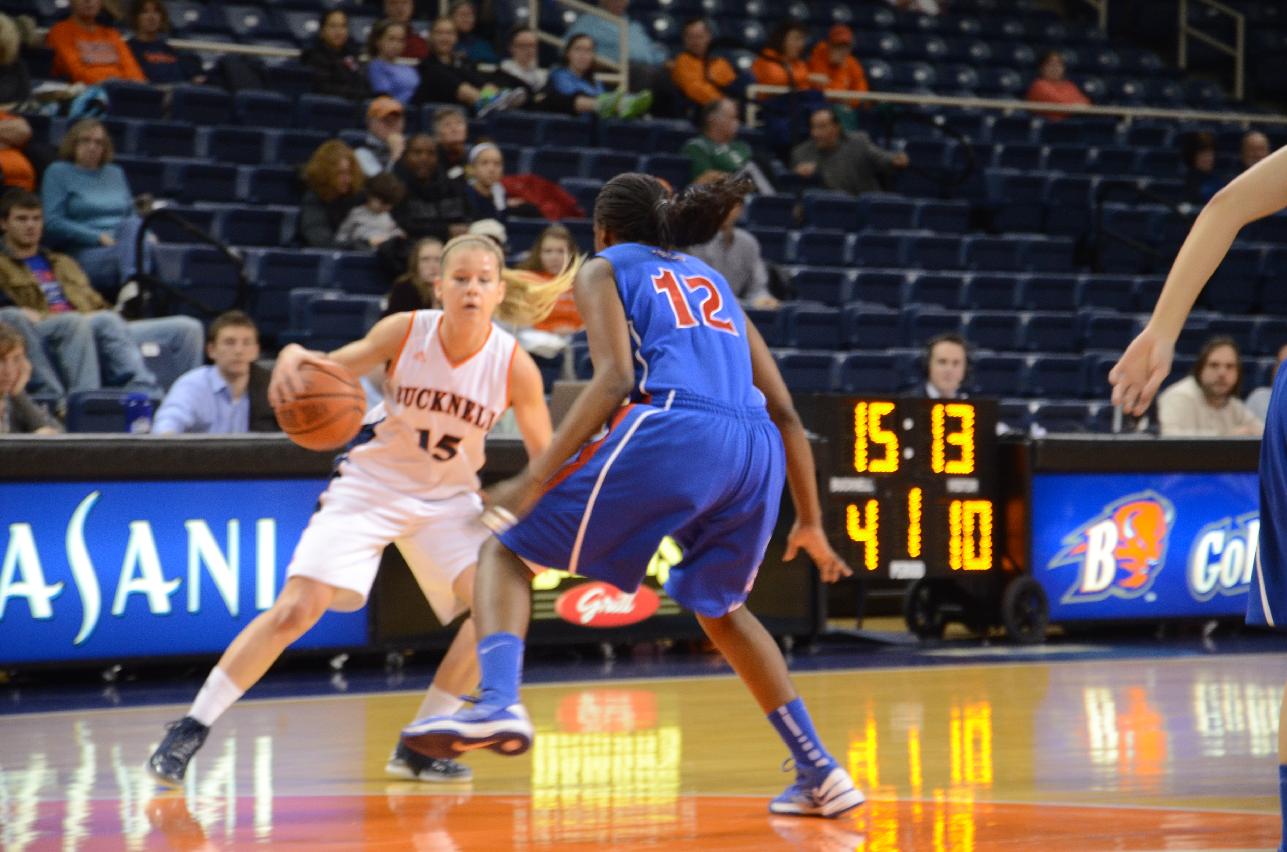 Heather Oros | The BucknellianShelby Romine '14 faces off against a defender. Her 23 points were not enough to defeat American.