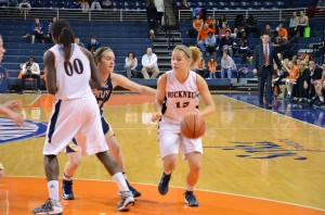 Heather Oros | The Bucknellian Shelby Romine '14 drives to the lane in the women's basketball team's 55-48 upset win over Navy on Senior Night.